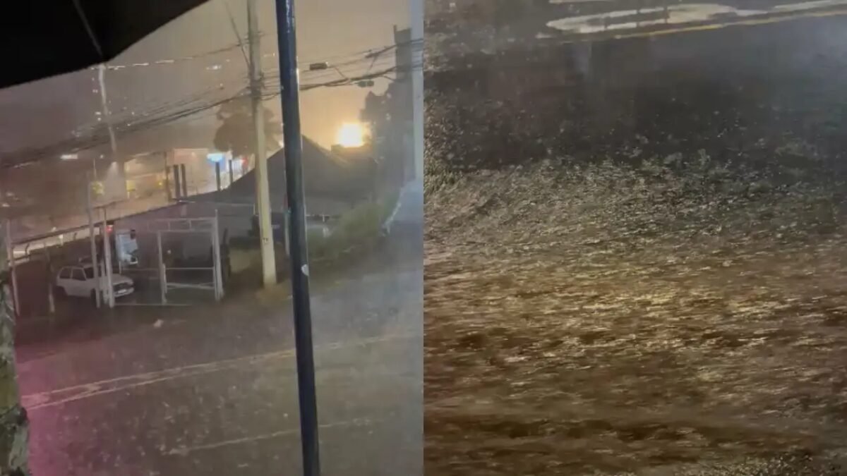 Rua alagada e chuva intensa em Belo Horizonte com forte correnteza de água turva cobrindo a via